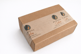 Brown cardboard box with branding on a white background