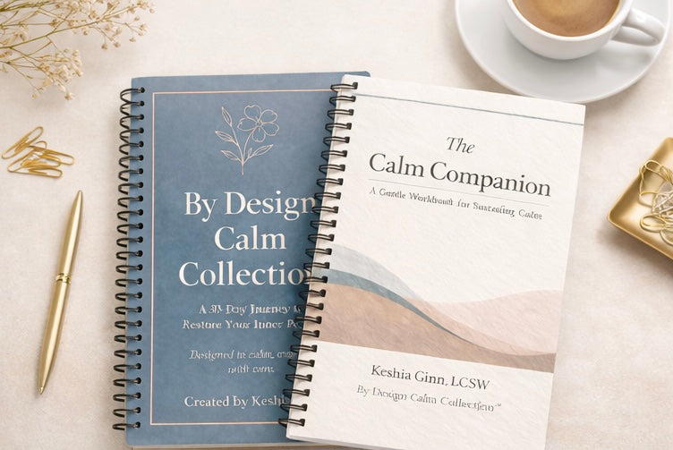 Two spiral-bound books titled 'The Calm Companion' and 'By Design Calm Collection' on a light surface with a cup of coffee and pen.