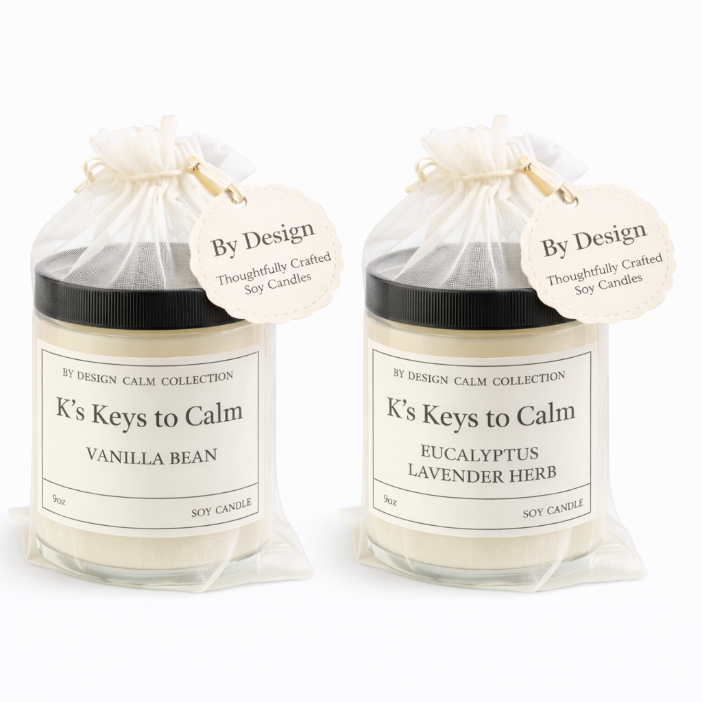 Two candles from K's Keys to Calm collection in packaging on a white background