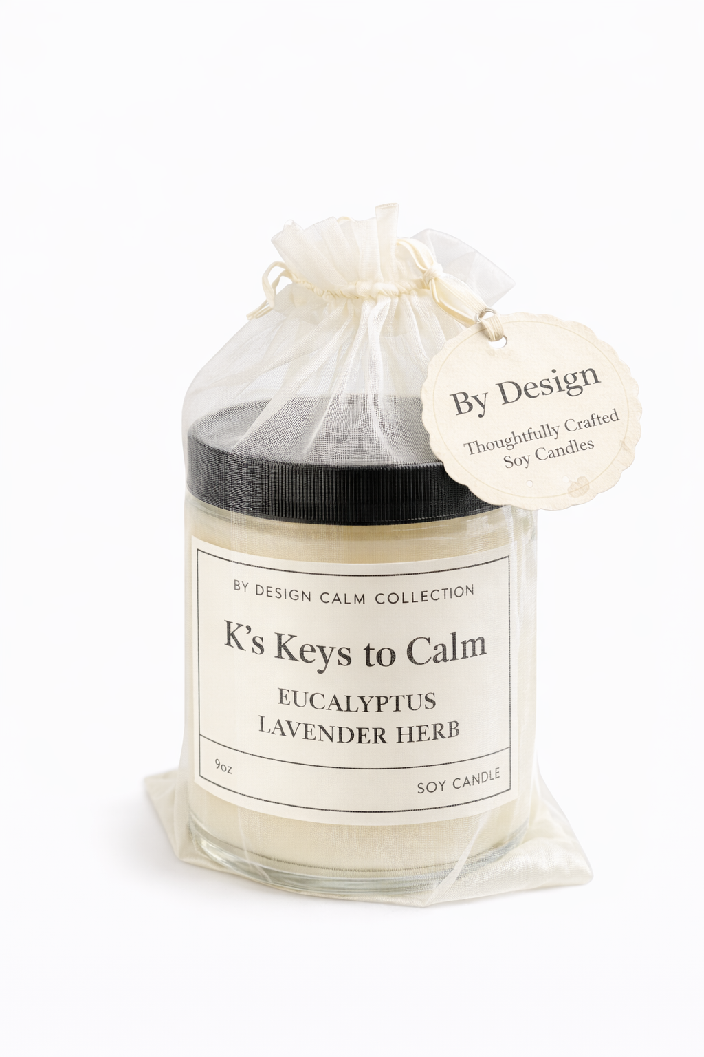 Candle labeled 'K's Keys to Calm' with a 'By Design' tag on a white background