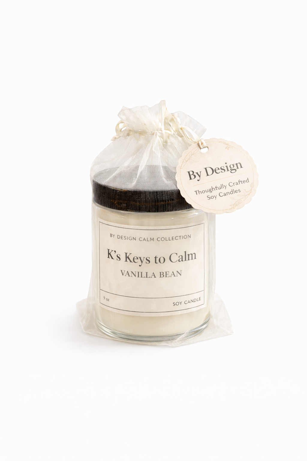 Vanilla bean candle in a clear glass jar with a white label on a white background