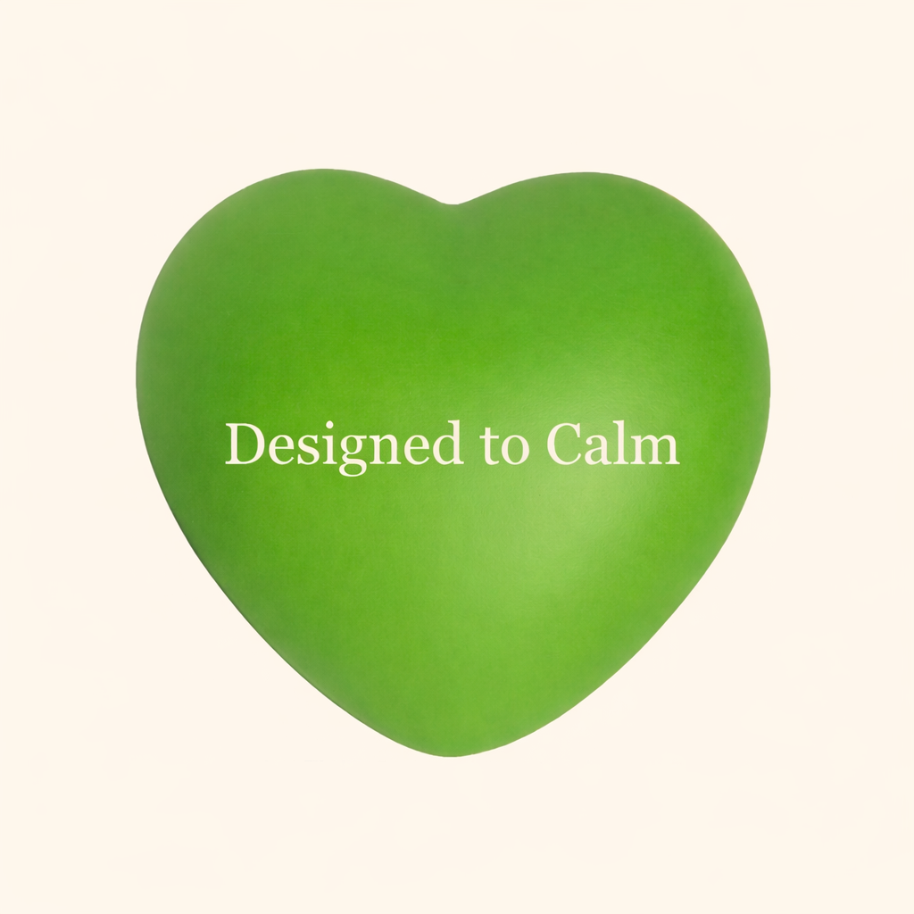 Green heart-shaped object with 'Designed to Calm' text on a beige background